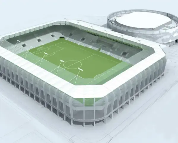 Nowoczesny stadion RKS Radomiak Radom z zieloną murawą i trybunami. Obok okrągły budynek.