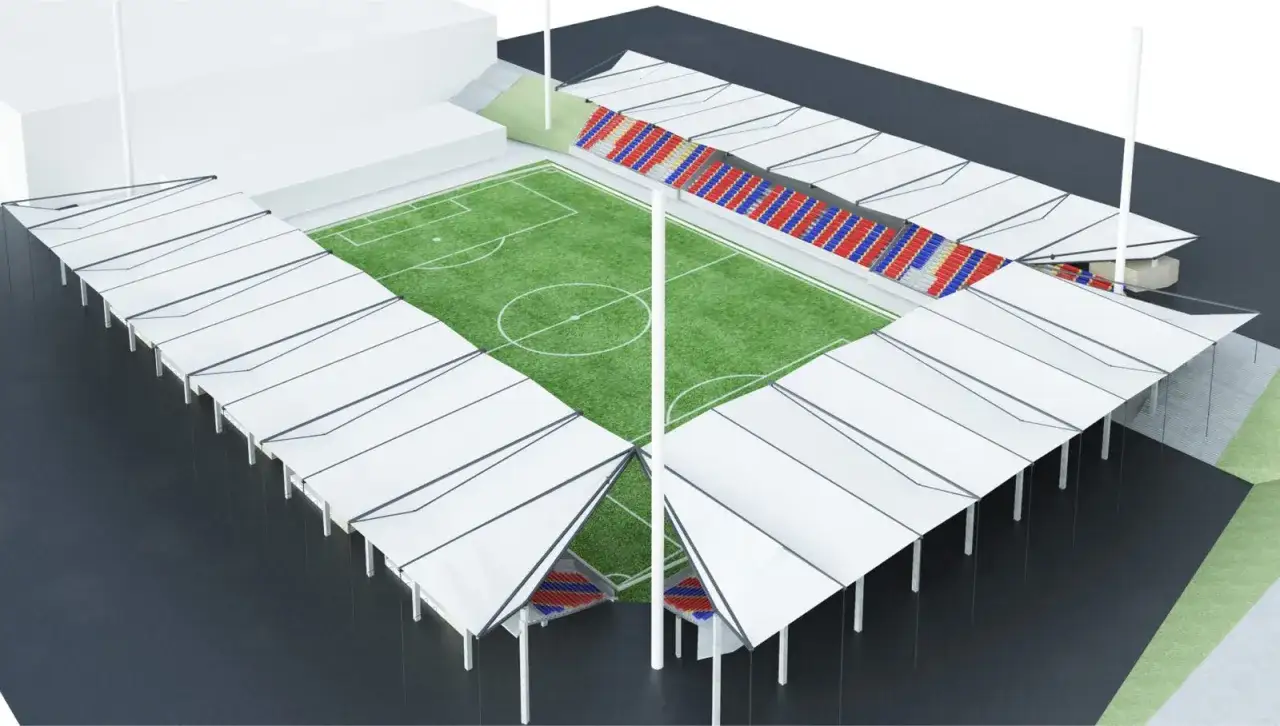 Wizualizacja nowego stadionu Polonii Bytom z zieloną murawą, trybunami w barwach czerwono-niebieskich i białymi zadaszeniami.
