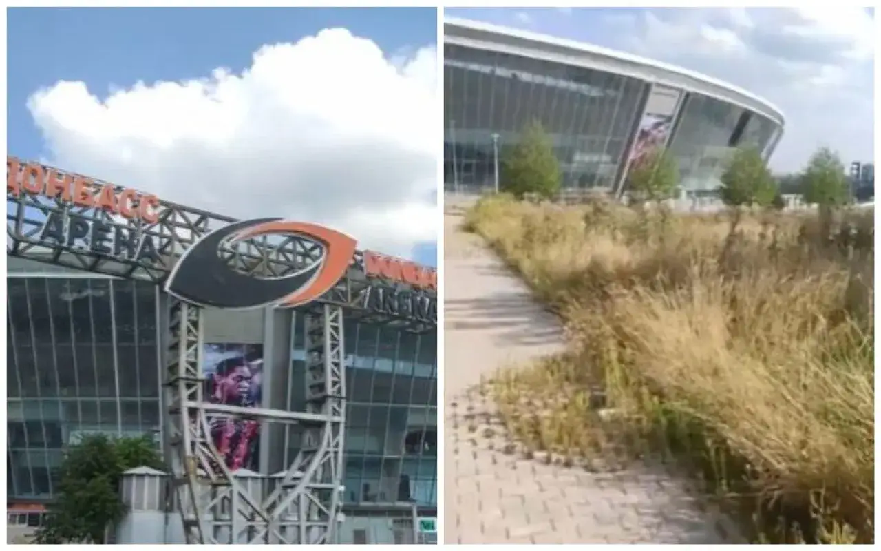 Donbass Arena z bliska i z oddali, zarośnięta trawa przy chodniku.